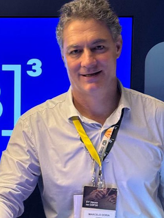 Marcelo at an event, wearing a conference badge